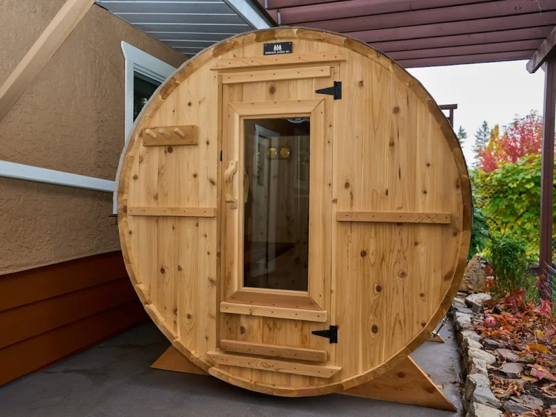 Compact cedar barrel sauna under a covered patio